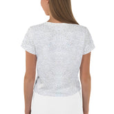 Close-up of geometric papercut pattern on trendy crop top.